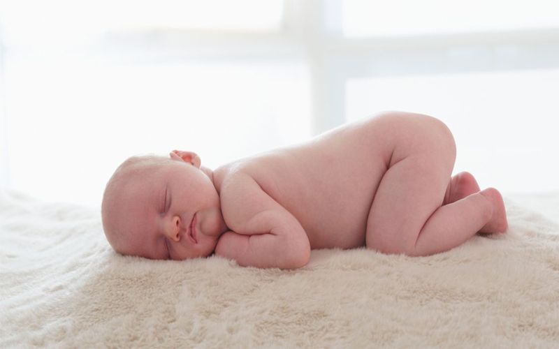 infant sleeping on stomach